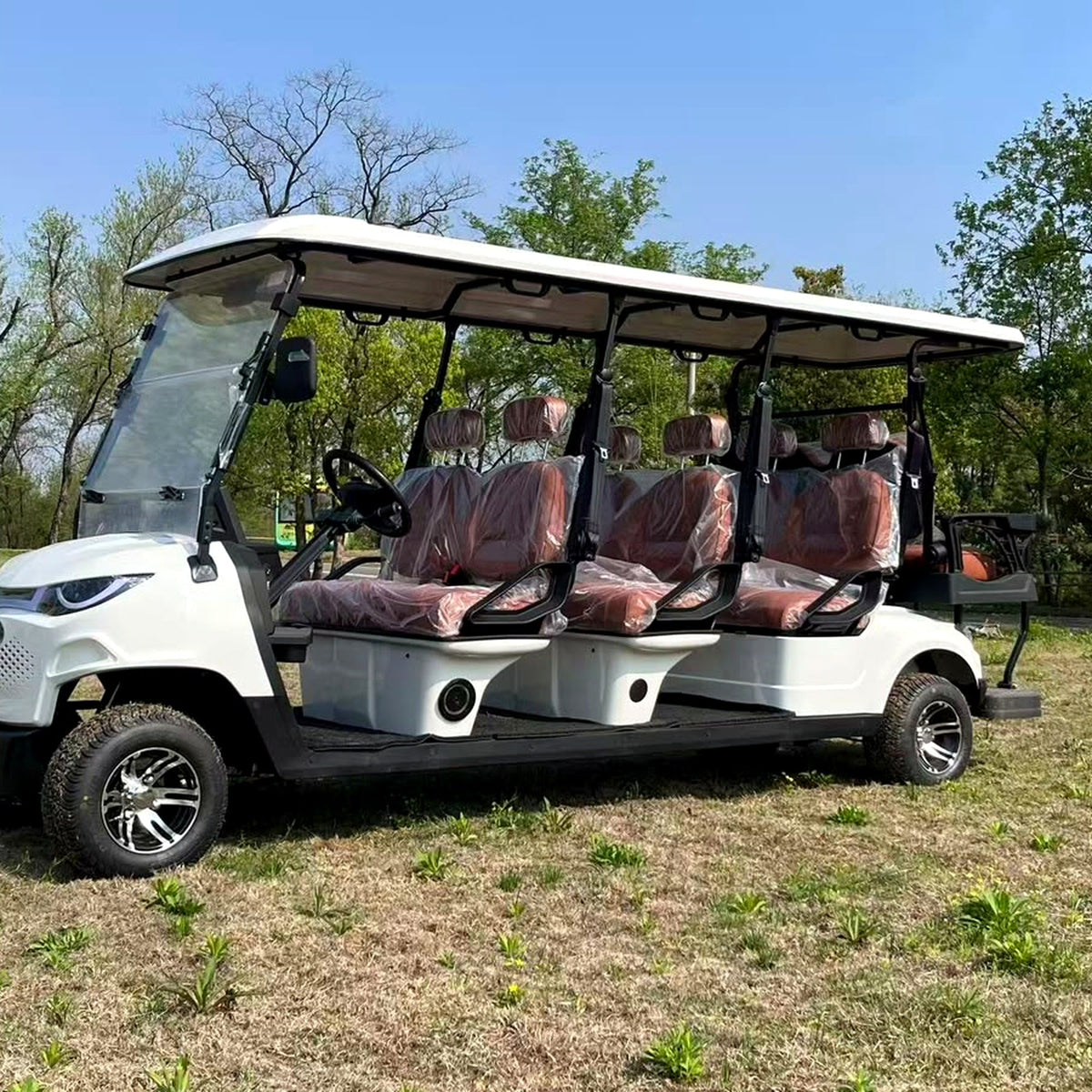 MXV Sovereign 8 white electric golf cart outdoors