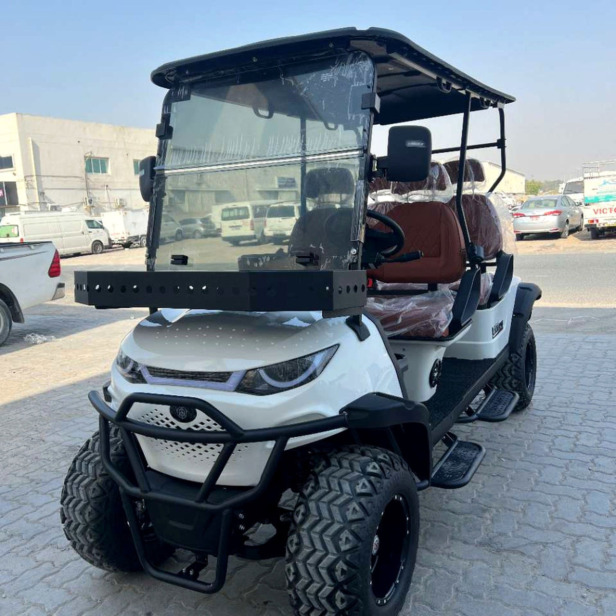 MXV Voyager 4 Trail 4-seater electric golf cart in an outdoor setting